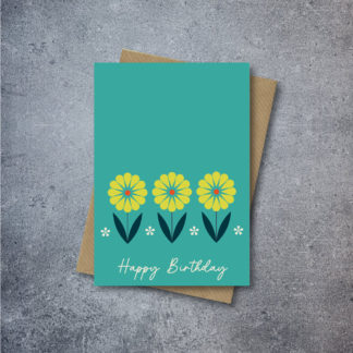 alt="Teal Mexican Flowers Card that says 'Happy Birthday' on a Kraft brown envelope"